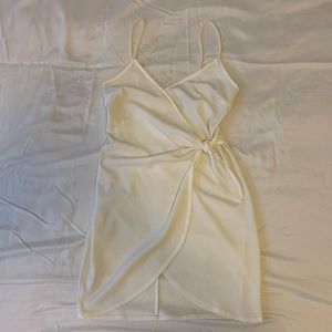 Wrap mini dress with tie at waist. From Pitaya Boutique